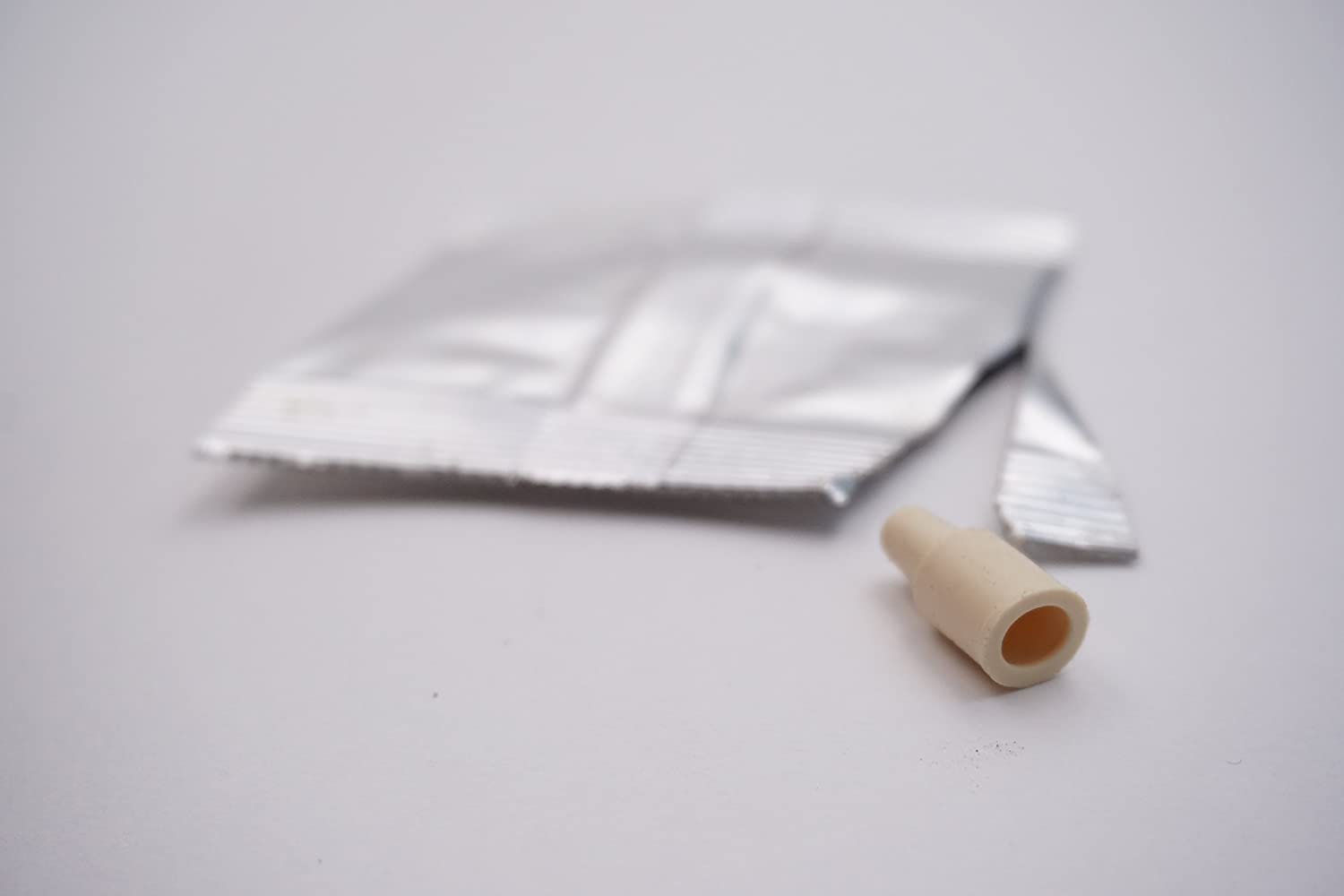 Photo of an opened pheromone lure.