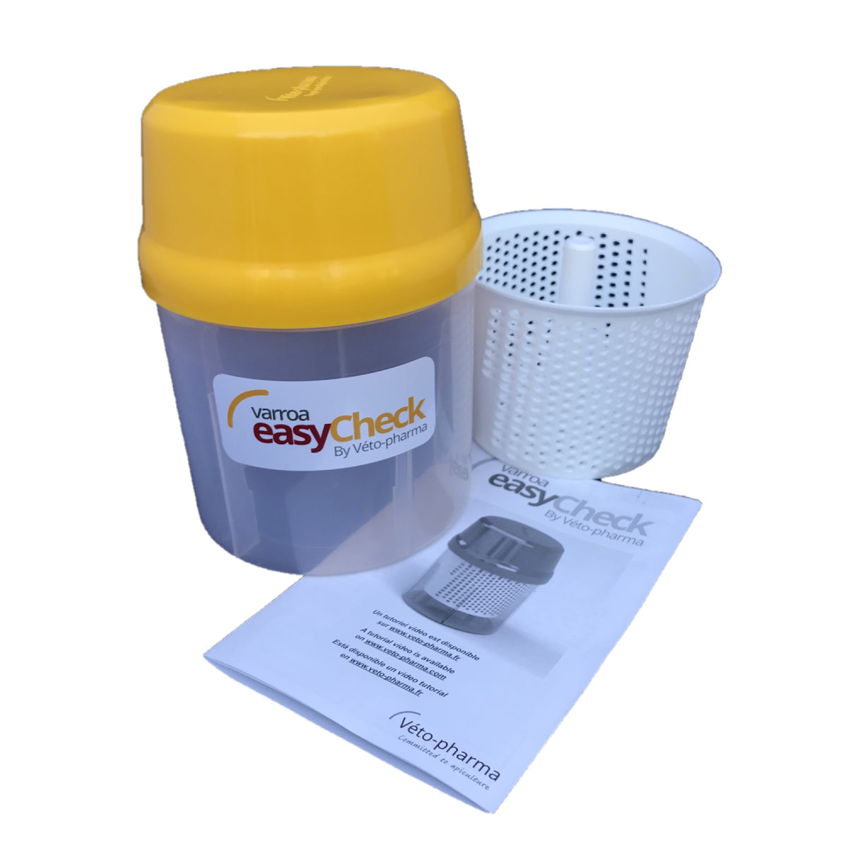 Photo of opened Varroa EasyCheck container and instruction manual.