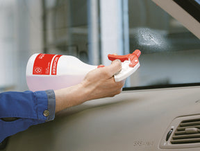 Photo of an individual using the Birchmeier Foxy Plus on a car window.